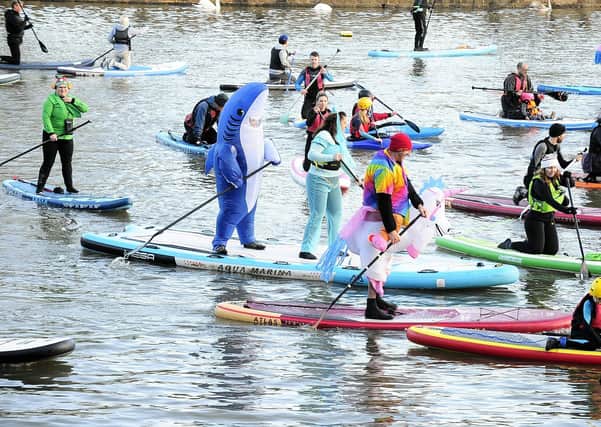 Members of Leeds Dock Paddle Boarding and White Rose Canoe Club were among those braving the waters in colourful and crazy costumes.
