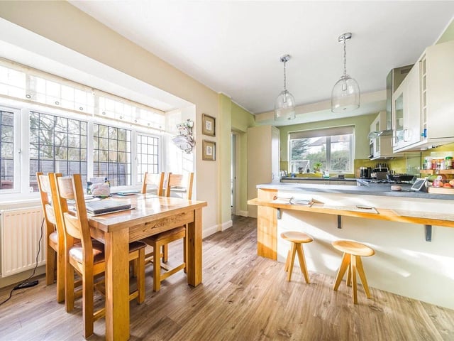 The stunning dining kitchen has integrated appliances and access to the utility and downstairs w.c.