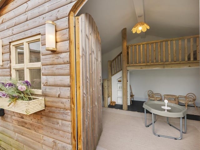 A substantial summer house provides outstanding additional accommodation and is fully insulated and equipped with power and heating for year-round use.