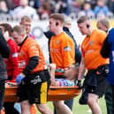 Wigan's Willie Isa is stretchered off after being injured in Sunday's Challenge Cup win at Castleford Tigers. Picture by Allan McKenzie/SWpix.com.
