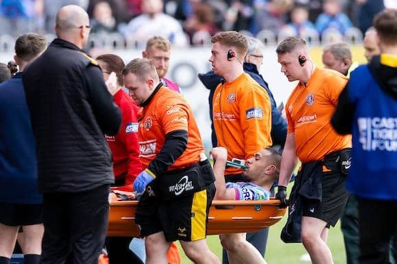 Wigan's Willie Isa is stretchered off after being injured in Sunday's Challenge Cup win at Castleford Tigers. Picture by Allan McKenzie/SWpix.com.