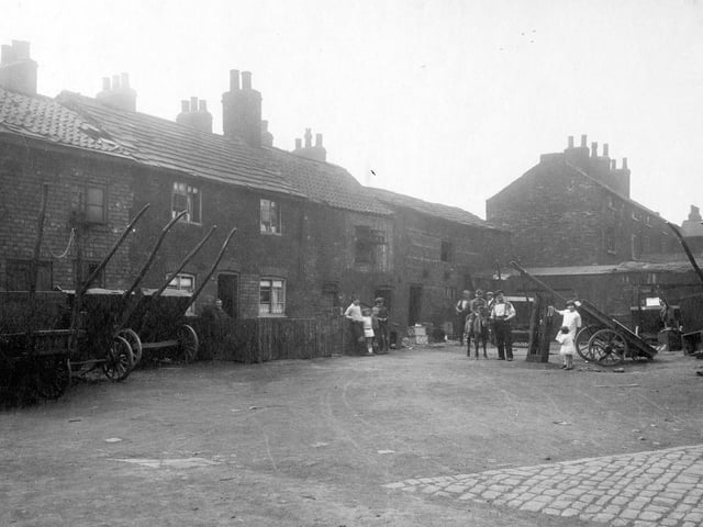 Finny Yard, located on a corner plot of land, fronting on Low Road and Church Street in August 1929.