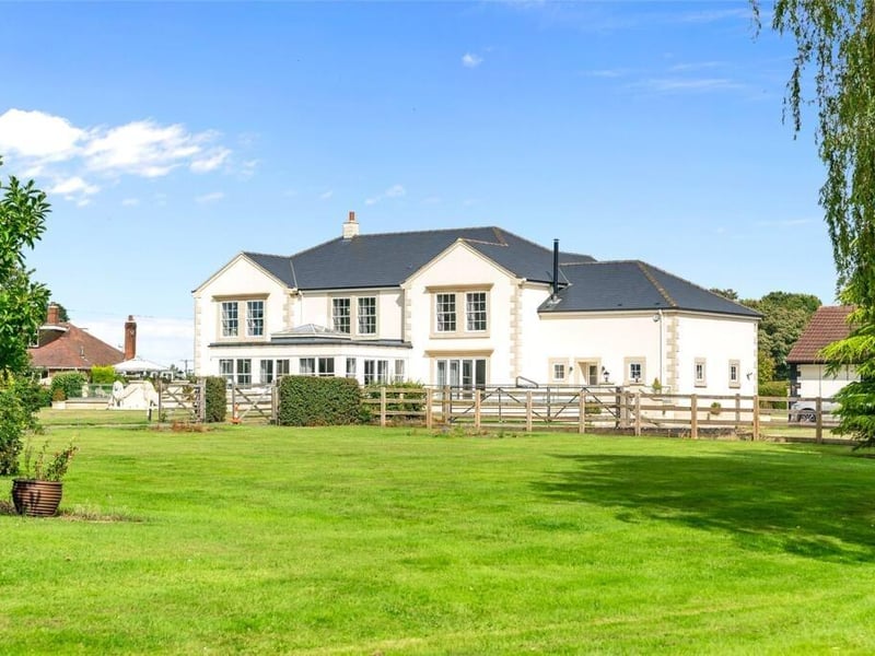 The property, set in approximately four acres, offers luxury, comfort, and style.