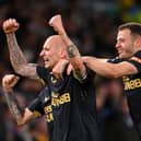 LEEDS, ENGLAND - JANUARY 22: Jonjo Shelvey celebrates with teammate Ryan Fraser (R) of Newcastle after scoring their team's first goal during the Premier League match between Leeds United and Newcastle United at Elland Road on January 22, 2022 in Leeds, England. (Photo by Stu Forster/Getty Images)