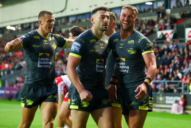 Jake Connor, middle of picture, had yet another big game for Leeds Rhinos in their 34-6 win at St Helens. Picture by Paul Currie/SWpix.com.