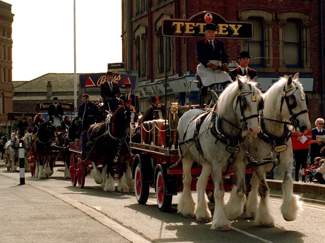 Celebrating the third anniversary of the opening of Tetley's Brewery Wharf, a parade of seven brewers drays paraded through the city centre in March 1997. Here, Prince and Charles pulling one of the two Tetley's drays, head the parade as it makes its way over Leeds Bridge.