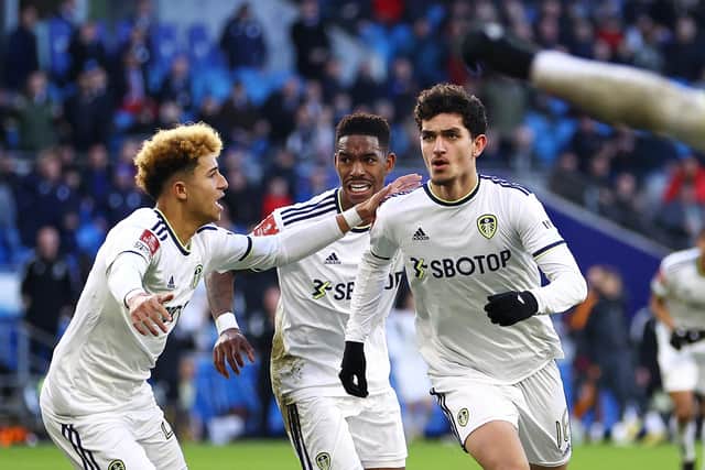 CARDIFF, WALES - JANUARY 08: Sonny Perkins of Leeds United celebrates with teammate Mateo Fernandez after scoring the team's second goal during the Emirates FA Cup Third Round match between Cardiff City and Leeds United at Cardiff City Stadium on January 08, 2023 in Cardiff, Wales. (Photo by Michael Steele/Getty Images)