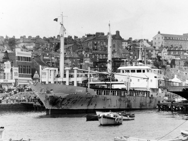 Holidaymakers crowd around Whitby swing bridge in August 1978 as it opened to allow this cargo ship through, The Sabine, a Norwegian Vessel was delivering timber for a new yacht jetty in the town.