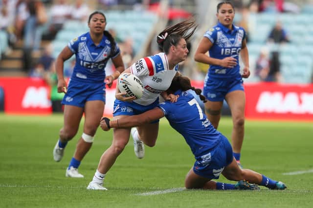 England's Fran Goldthorp is tackled by Samoa's Pauline Piliae-Rasabale. Picture by David Neilson/SWpix.com.