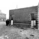 A toilet on Church Street pictured in April 1927. Co-operative society Ltd can be seen on right. On junction with Grove Road.