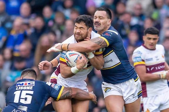 Zane Tetevano tackles Huddersfield's Esan Marsters during Rhinos' win at Headingley in April. Picture by Allan McKenzie/SWpix.com.