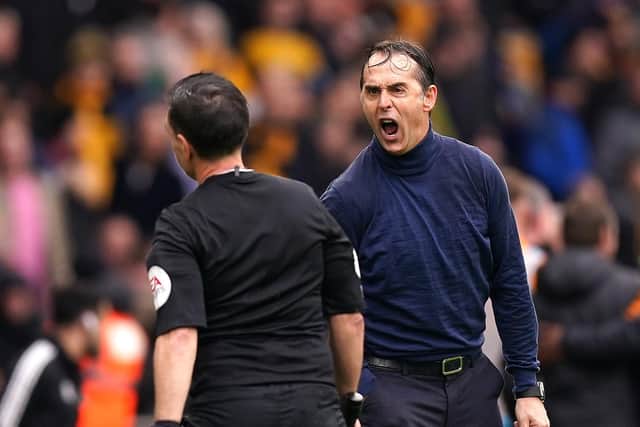 Wolverhampton Wanderers manager Julen Lopetegui (right) reacts to assistant referee Gary Beswick during the Premier League match at Molineux Stadium, Wolverhampton. Picture date: Saturday March 18, 2023. (Credit: PA)