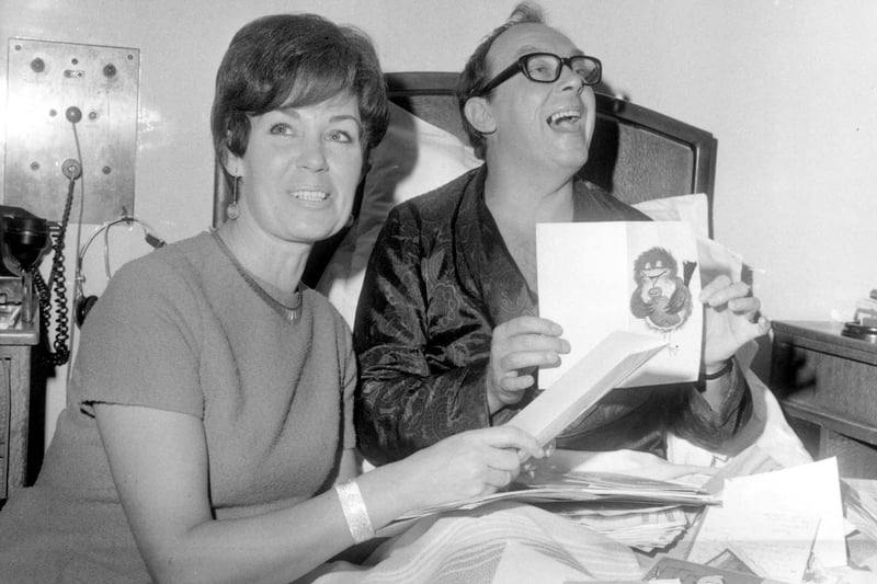 Eric Morecambe in the Brotherton Wing at Leeds General Infirmary with his wife Joan in November 1968. This was two weeks after his heart attack and he was on the way to recovery. He is seen looking through get well cards.