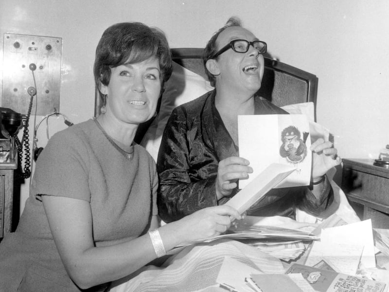 Eric Morecambe in the Brotherton Wing at Leeds General Infirmary with his wife Joan in November 1968. This was two weeks after his heart attack and he was on the way to recovery. He is seen looking through get well cards.