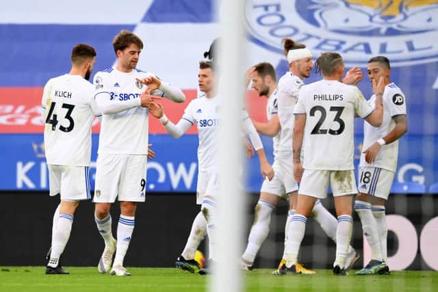 Patrick Bamford celebrates with team mates after scoring their side's second goal against Leicester.
