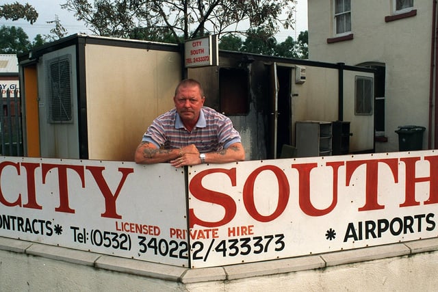 Dave Shortall, of City South private car hire in Beeston, with his burnt-out portakabin office. Pictured in August 1999.