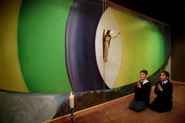 Pupils Joseph McCall and Sarah Bray pray in the special prayer room at St Anthony's RC Primary School n January 1996. The pray room was in memory of the late Coun Paddy Crotty, who died in 1995.