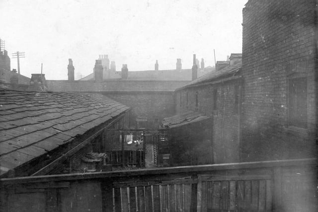 A View of rooftops and back yards of slum dwellings on Armley Road. Some ducks can be seen in centre of image. Pictured in February 1929.