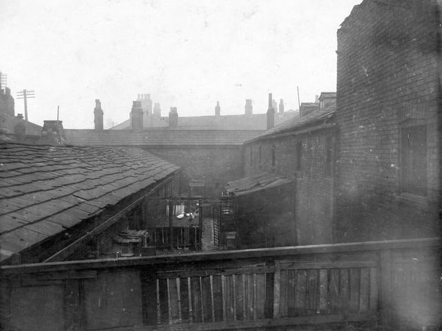 A View of rooftops and back yards of slum dwellings on Armley Road. Some ducks can be seen in centre of image. Pictured in February 1929.