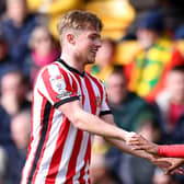 NORWICH, ENGLAND - MARCH 12: Abdoullah Ba of Sunderland celebrates scoring the opening goal with Joe Gelhardt during the Sky Bet Championship match between Norwich City and Sunderland at Carrow Road on March 12, 2023 in Norwich, England. (Photo by Stephen Pond/Getty Images)
