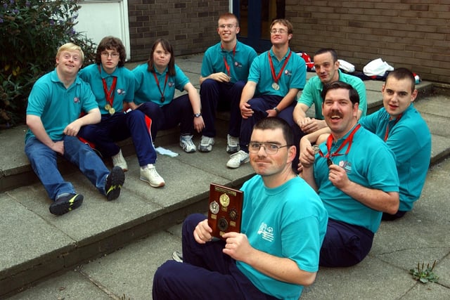 Pudsey Special Olympics team display their medals in September 2003 after competing in the National Special Olympics Championships.