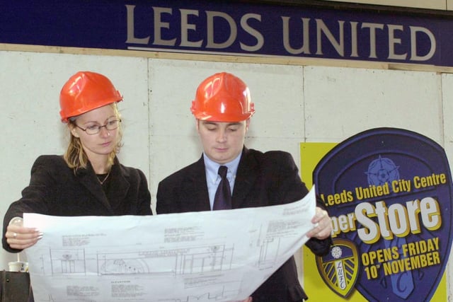 Leeds United FC's Caaren Loten, deputy merchandising manager and Drew Mullin, business development manager, examine the plans for the club's proposed new city centre superstore on Albion Street in November 2000.