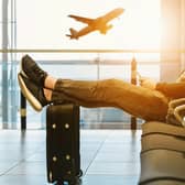 Passenger waits in the departure lounge of an airport