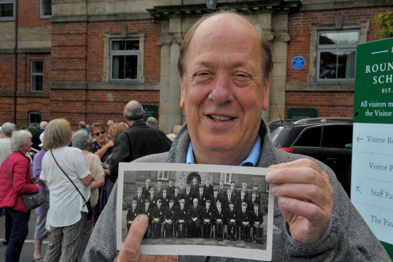 Howard Finley points to himself on his old school class photo