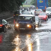 Drivers make their way through flood waters at Cooper Bridge in Mirfield in 2012.
