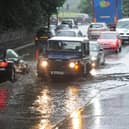 Drivers make their way through flood waters at Cooper Bridge in Mirfield in 2012.