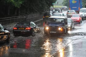 Drivers make their way through flood waters at Cooper Bridge in Mirfield in 2012.