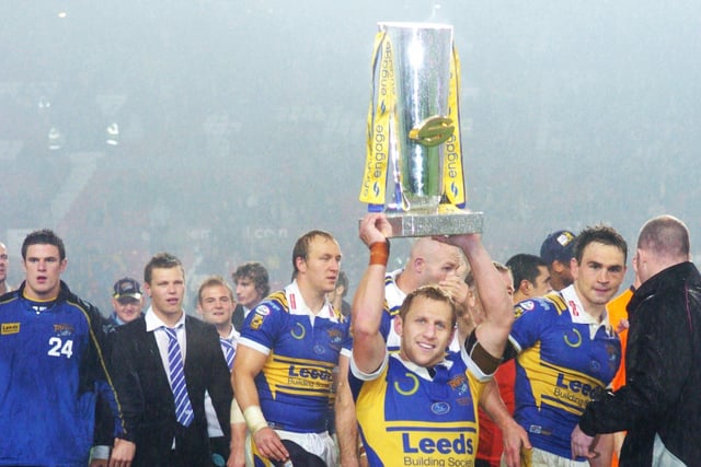 Rob Burrow proudly holds the trophy after Leeds Rhinos won the Grand Final at Old Trafford in 2018.