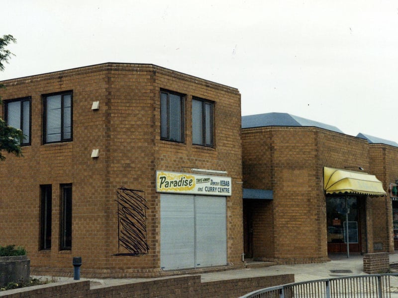 Part of the Fraternity House complex on Church Street, including the Paradise Kebab and Curry Centre in the foreground and a chemist on the right. Pictured in May 1990.