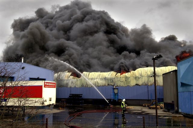 Firefighters battle a fire at the Power House Distribution warehouse, Normanton, Castleford. The blaze lasted for several hours on Sunday causing the closure of several roads in the area. Pictured on February 3, 2002.