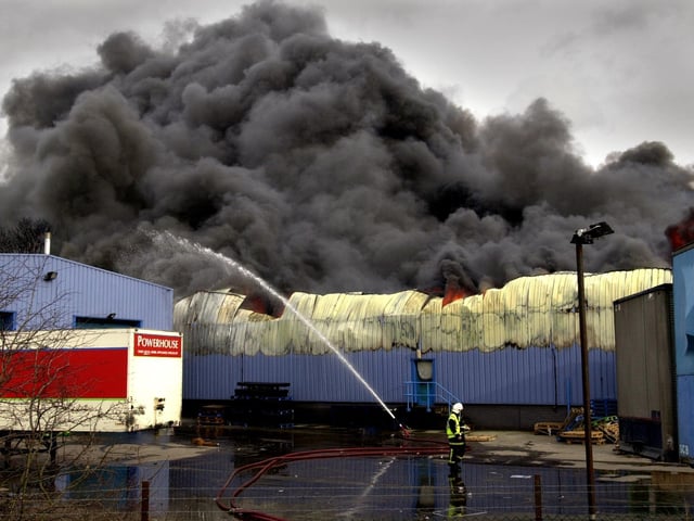 Firefighters battle a fire at the Power House Distribution warehouse, Normanton, Castleford. The blaze lasted for several hours on Sunday causing the closure of several roads in the area. Pictured on February 3, 2002.