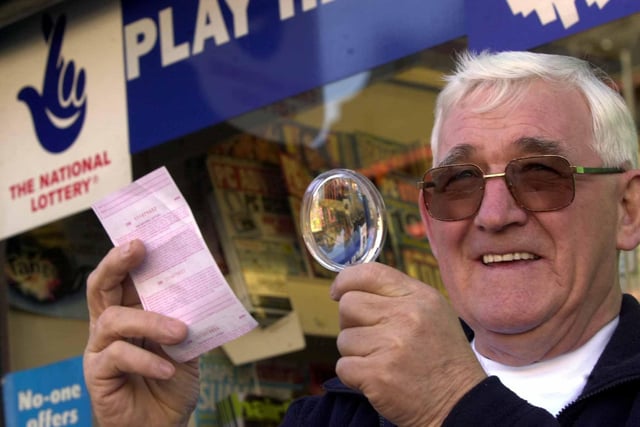 Tom Little, from Castleford, who won the lottery, pictured checking his numbers with a magnifying glass on March 1, 2002.