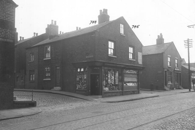 A cobbled Balm Road with tramlines near the junction with Wright Street in September 1935. The shop at number 45 is Bertie Colin Crookson, draper, who has a window display of goods with price tickets.