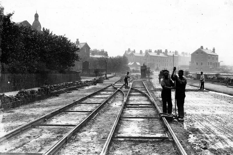 Tram lines being laid on Roundhay Road in May 1889, near to the junction with Gathorne Street, seen on the left with the United Methodist Free Church in the background. This tramway would have formed part of the line from Sheepscar to Oakwood, on which the first steam powered trams in Leeds operated from May 1891.