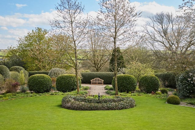 The property is also a haven for gardening enthusiasts. A raised terrace has steps leading down to the south facing mature gardens that are bordered by manicured hedges and layer beds. These give way to a yew parterre with gravel path leading to the lower lawn which extends around the perimeter of the gardens, connecting opposing paddocks and framing either side of the property, creating a natural sense of privacy.