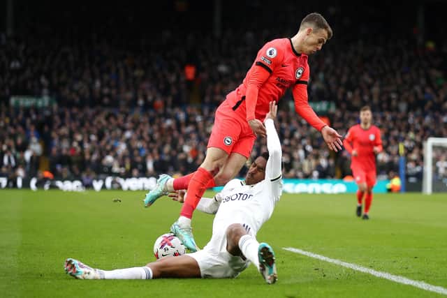 DING-DONG BATTLE - Leeds United's Junior Firpo came up against a dangerous, in-form opponent in Brighton's Solly March but the latter's joy was not always a Firpo problem. Pic: Getty