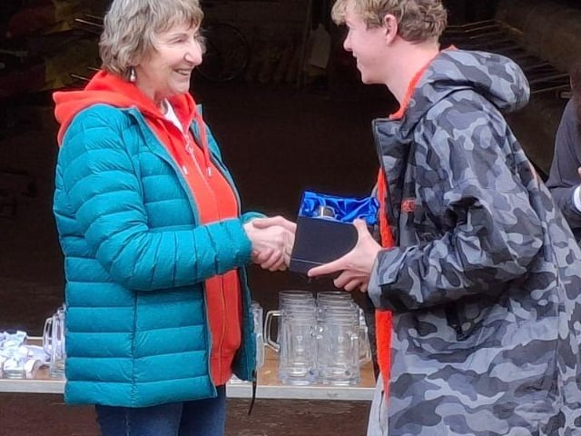Mike's mother presenting his award to Liam Carroll (Burton Leander)
