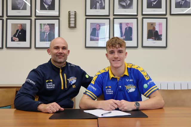 Fergus McCormack with coach Rohan Smith when he signed a full-time Rhinos contract in November, 2022. Picture by Leeds Rhinos.