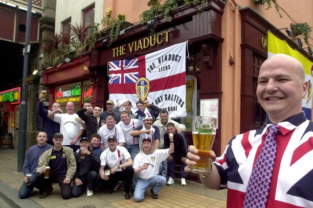 Regulars pictured at The Viaduct pub, on Lower Briggate, Leeds. They had raised money for their trip to the World Cup in Japan by getting four pubs to sponsore them, pictured on Monday May 20, 2002, right, landlord Les Hince with regulars and their sponsored flag.