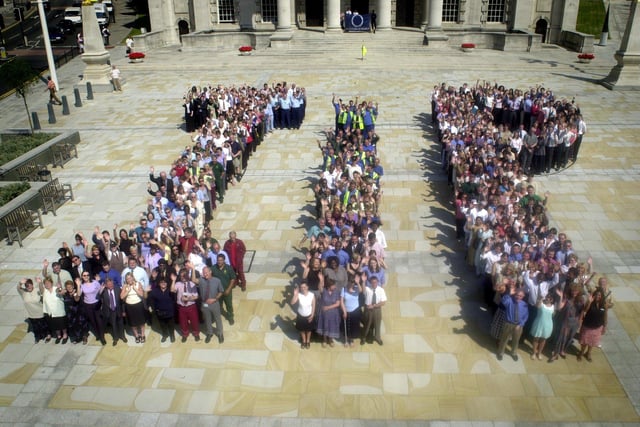 Council staff at Leeds Civic Hall spell-out the letters IIP, after receiving the Investor In People award.