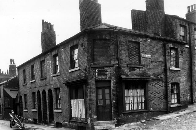 This is the junction of Upper North Street which is to the left and Earl Street on the right. Moving in from the left, the first house in view is 31 Upper North Street, followed to the right by 33 and 35. The corner property, previously a shop, was 37. On the right edge number 1 Earl Street can just be seen, this house had been bricked up. Pictured in August 1959.