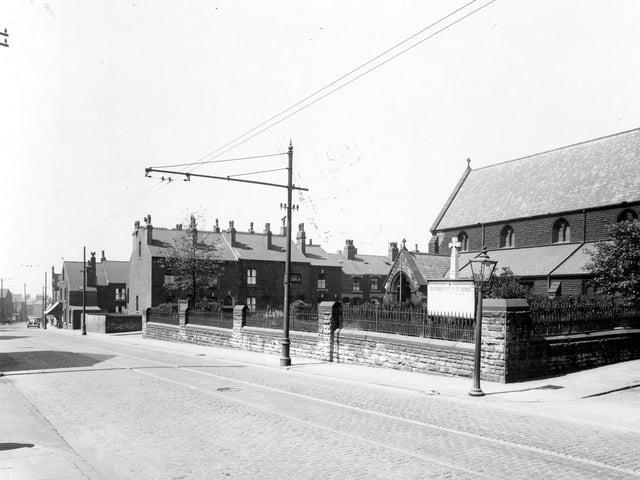 St. Agnes Church on Stoney Rock Lane in June 1939. The street to the left of the church is Rock Square, to the right Spink Road. The church was built in 1889, it cost £5,000. In Gothic style it was designed by architects Kelly and Birchall of Leeds. The reredos was given by the Burmantofts Pottery works. It was of Terra-cotta facience, for which the company was renowned.