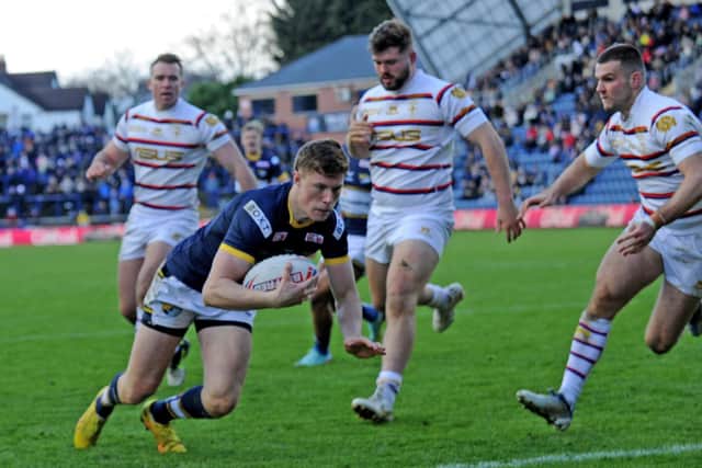 Morgan Gannon, seen scoring against Wakefield on Boxing Day, has been named in Rhinos' squad for the first time since February. Picture by Steve Riding.