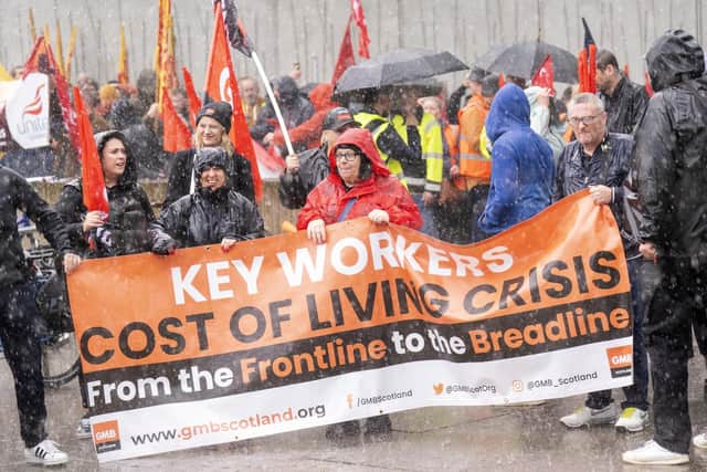 Pictured are people take part in the Scotland Demands a Pay Rise march. There have been numerous marches across the UK for the cost of living crisis, with the first Enough Is Enough rally taking place in Leeds today.