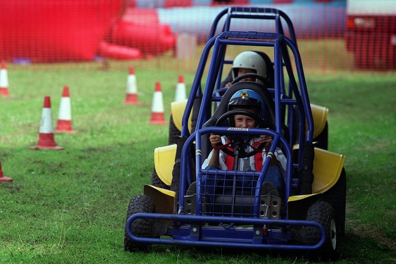 The race is on: Luke Fairburn is in the lead on the go-kart track at Rothwell Carnival held at Springhead Park in July 1997.