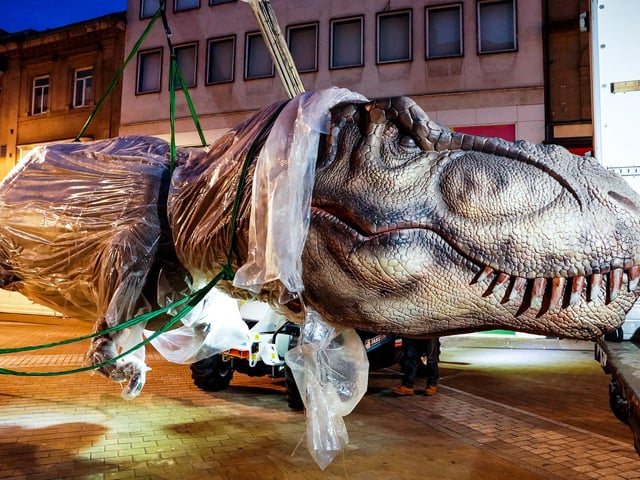 An enormous T-Rex was carefully transported along Briggate and Albion Street